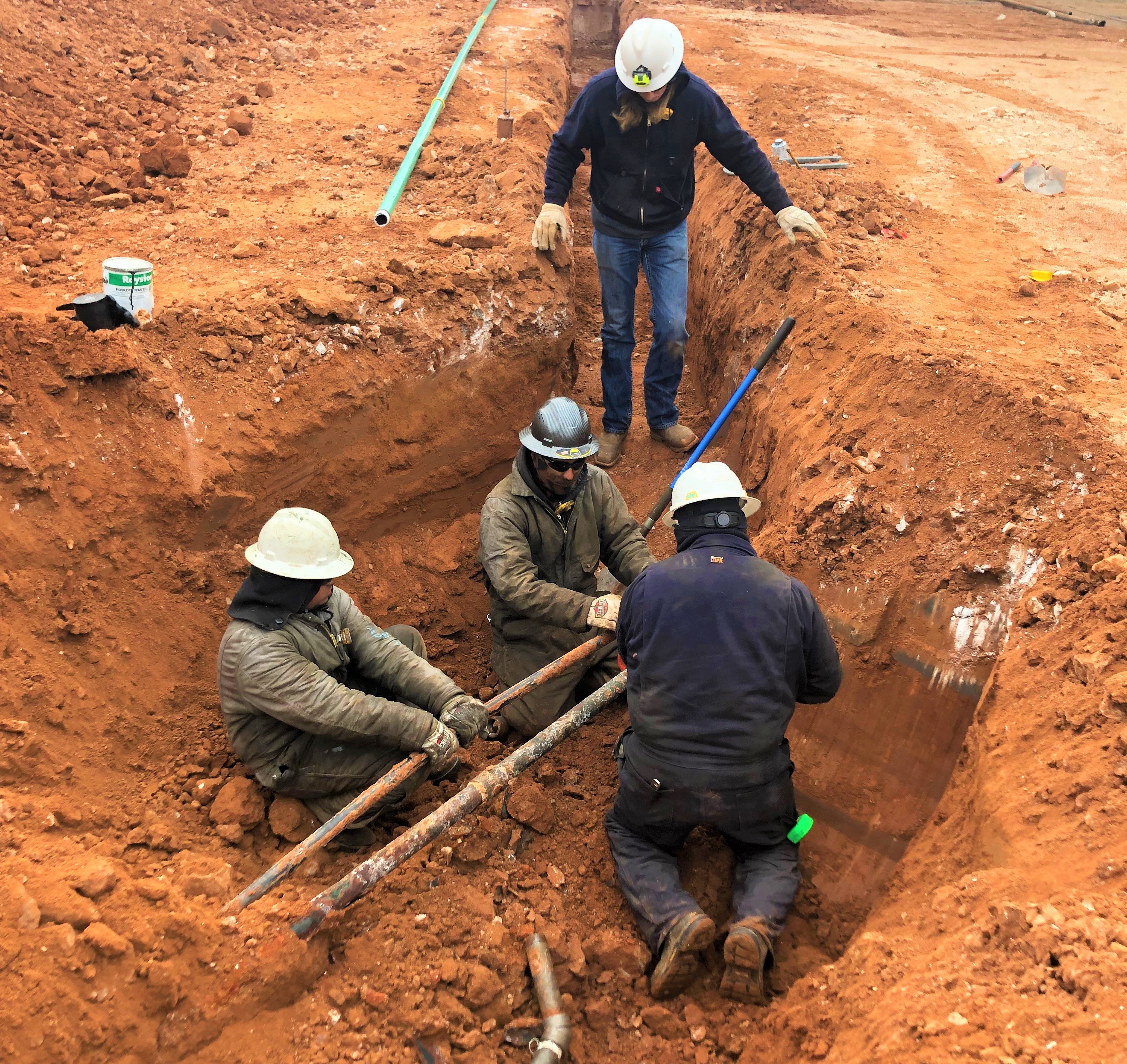 K&J Construction working in the trenches